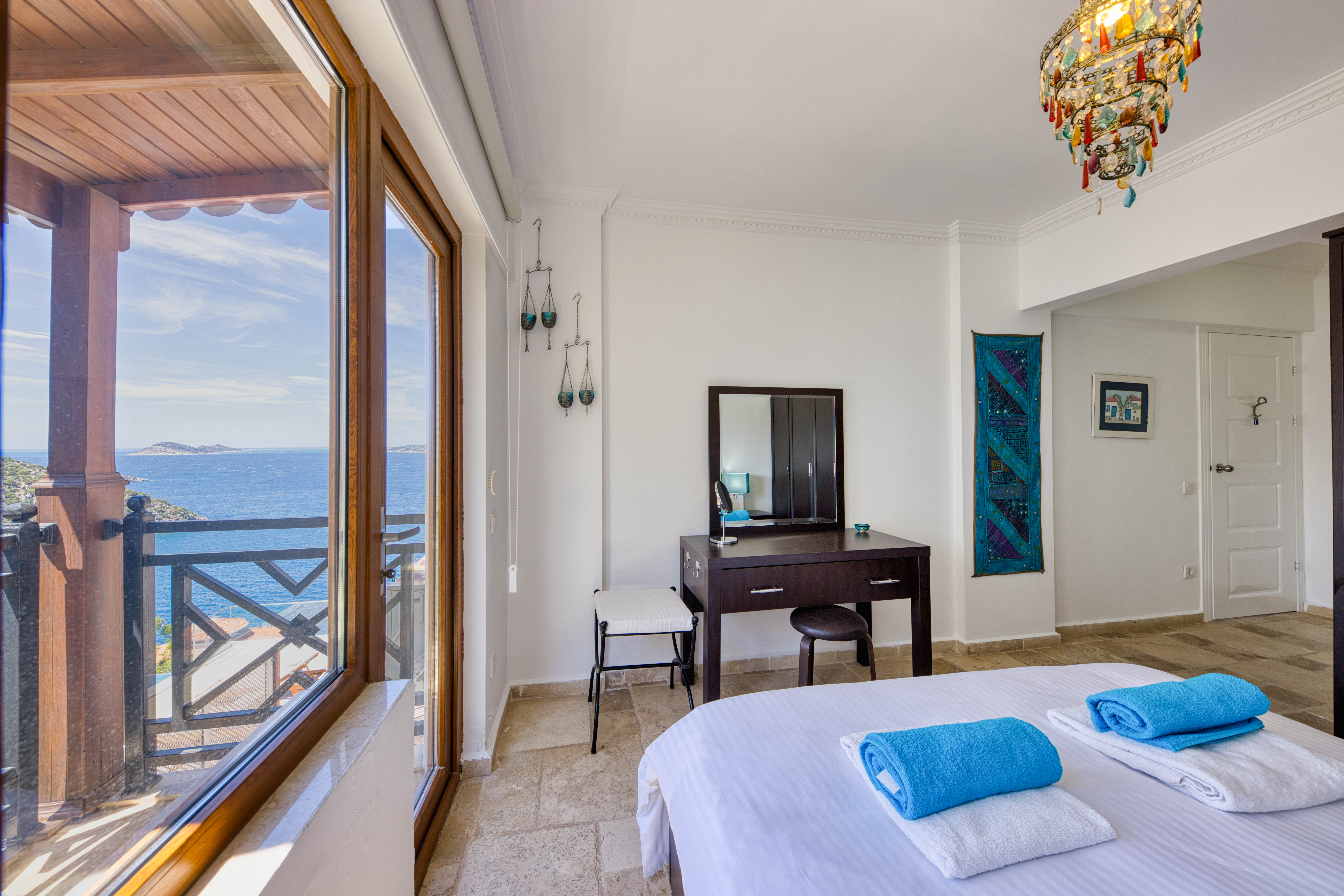 Master bedroom with dressing table and balcony view